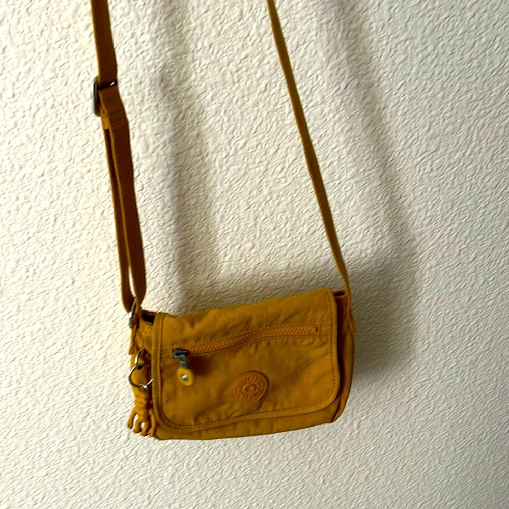 Yellow/gold Kipling crossbody purse